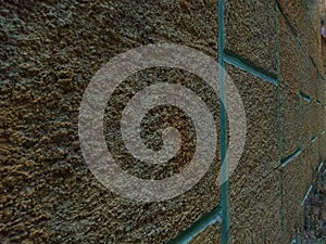 closeup of color saturation, texture and pattern on the exterior wall of the building