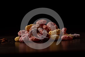 Closeup of colorful breakfast cereal on a wooden surface