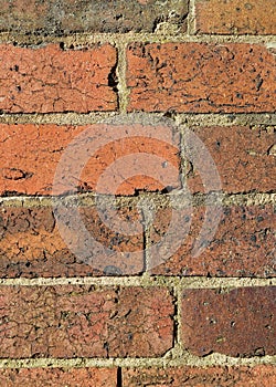 A closeup of a colorful brick wall in vertical format