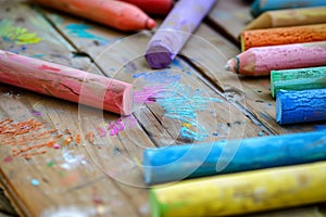 closeup of colorful chalks on wooden artists palette