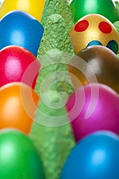 Closeup of colorful Easter eggs in egg box