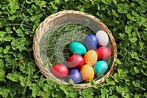 Closeup of colorful eggs in beautiful spring meadow on easter holiday outdoors in green graas.Traditional symbol for christian and