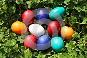 Closeup of colorful eggs in beautiful spring meadow on easter holiday outdoors in green graas.Traditional symbol for christian and