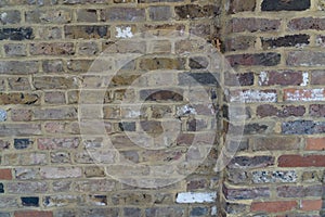 Closeup colorful facade brick wall evenly laid background