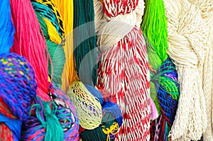 Closeup of colorful hammocks hanging knotted at the craft market