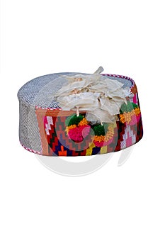 Closeup of a colorful handmade Indian traditional cap Himachali isolated on white background.