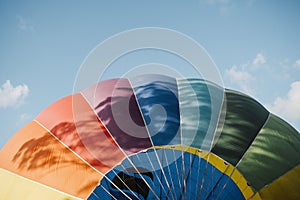Closeup of colorful hot air balloon against of blue sky