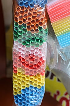 Closeup of colorful plastic straw tip in the market, Vietnam