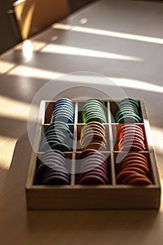 Closeup of colorful round wooden game pieces, used for counting, children's learning