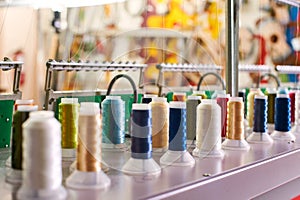 Closeup Colorful Spool of Thread on the Sewing Equipment, Fabric and Textile Industry, Embroidery machine