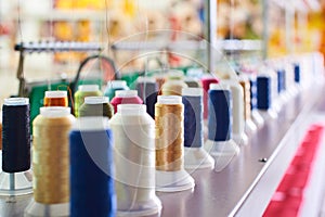 Closeup Colorful Spool of Thread on the Sewing Equipment, Fabric and Textile Industry, Embroidery machine