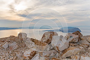 Closeup of colorful stones by sunset at cliffs on croatias mediterranean coast photo