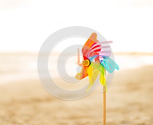 Closeup on colorful windmill toy on the beach