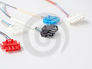 Closeup colorful wire connectors and wires on a white background