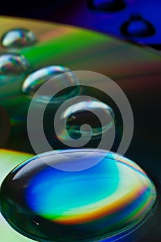 Closeup of compact disk with big water droplets