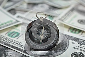 Closeup of a compass on U.S. Dollar banknotes