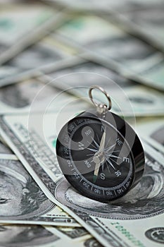 Closeup of a compass on U.S. Dollar banknotes