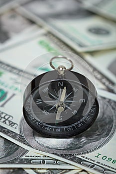 Closeup of a compass on U.S. Dollar banknotes