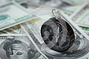 Closeup of a compass on U.S. Dollar banknotes