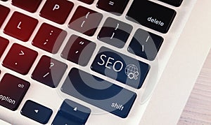 Closeup Of Computer Keyboard With Keyword Seo, White Background