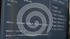 Closeup of computer screen of system engineer typing source code