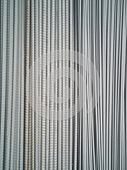 Closeup of concrete reinforcement steel rods in warehouse. Steel rods or bars used to reinforce concrete Steel rod. Construction