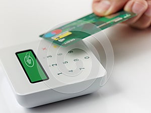 Closeup Contactless payment by credit or debit card succesful payment