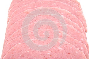 Closeup of cooked and boiled ham sausage slices.