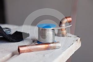 Closeup copper pipes, fittings, aluminum flux paste for solder for brazing with gas burner. Concept installation, repair, change