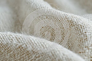 Closeup of cotton fabric texture highlighting the delicate weave and natural fibers softness in every thread