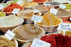 Closeup of a counter with a big variety of spices on Jerusalem market in Israel.