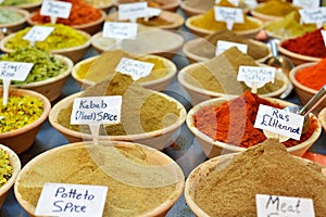 Closeup of a counter with a big variety of spices on Jerusalem market in Israel.