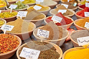 Closeup of a counter with a big variety of spices on Jerusalem market in Israel.