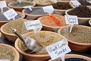 Closeup of a counter with a big variety of spices on Jerusalem market in Israel.