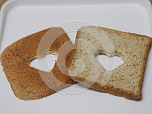 Couple Heart shaped on Whole Wheat Bread put on white tray, background love Valentine Day