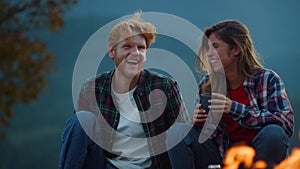 Closeup couple laugh outdoors together in mountains. Family enjoy time on nature.