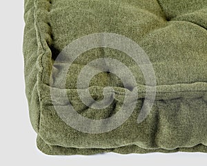 Closeup of cozy green linen floor cushion for home decor