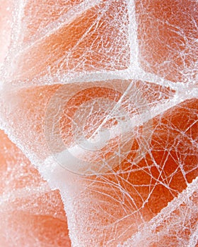 Closeup of cracked orange ice surface