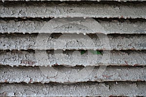 Closeup of cracked painted ventilating grill