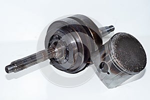 Closeup of crankshaft bearing overheating with piston impact marks on white background