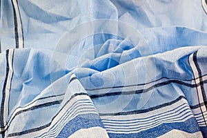 A closeup of a creased handkerchief.