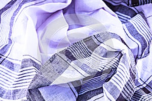 A closeup of a creased handkerchief.