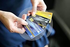 Closeup of credit card holded by hand,selective of focus,Concept of savings, salary, payment and funds