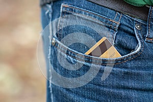 Closeup of credit card in jeans trousers pocket