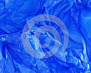 A closeup of crushed paper in blue.