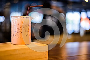 Closeup of a cup of coffee at coffee shop background