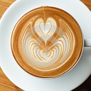 Closeup cup of coffee latte art on square frame image top view.