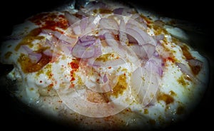 Closeup of curd, Indian spices, onion slices, food photography,  homemade cheese dip, marination of vegetable barbecue preparation photo