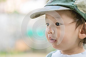 Closeup cute asian kid with interest in something emotion with copy space