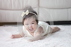 Closeup cute baby girl in funny motion